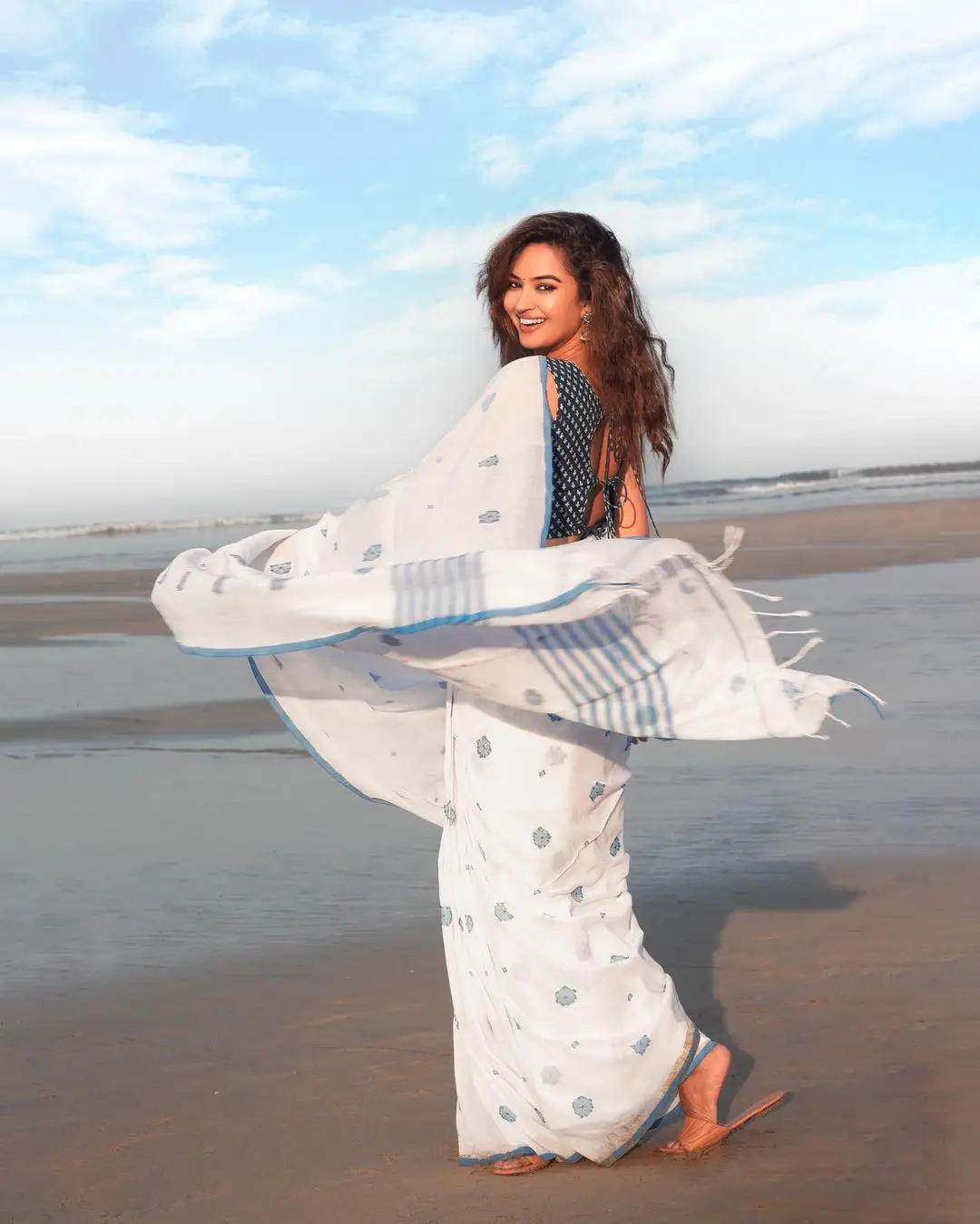 Pujita Ponnada cute photos in Saree at Beach