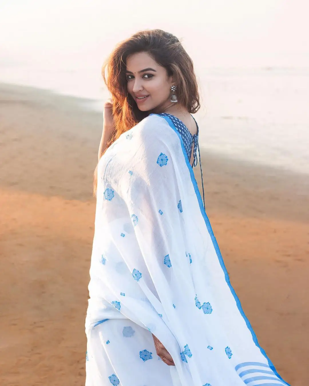 Pujita Ponnada cute photos in Saree at Beach