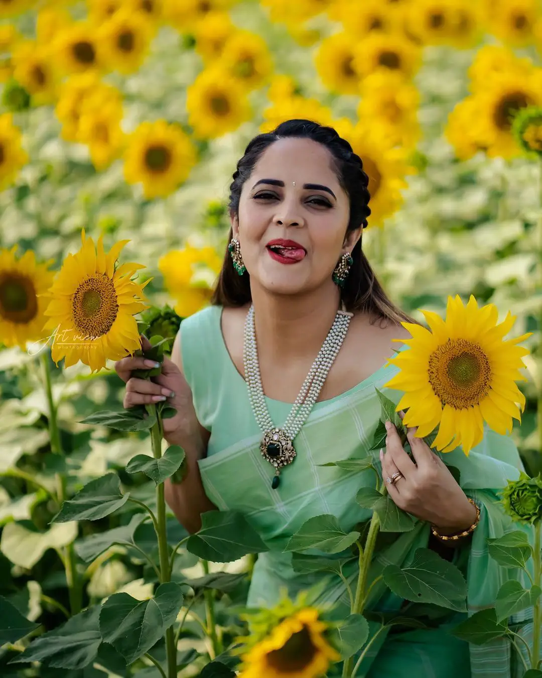 Anasuya enjoying in Sunflower Garden