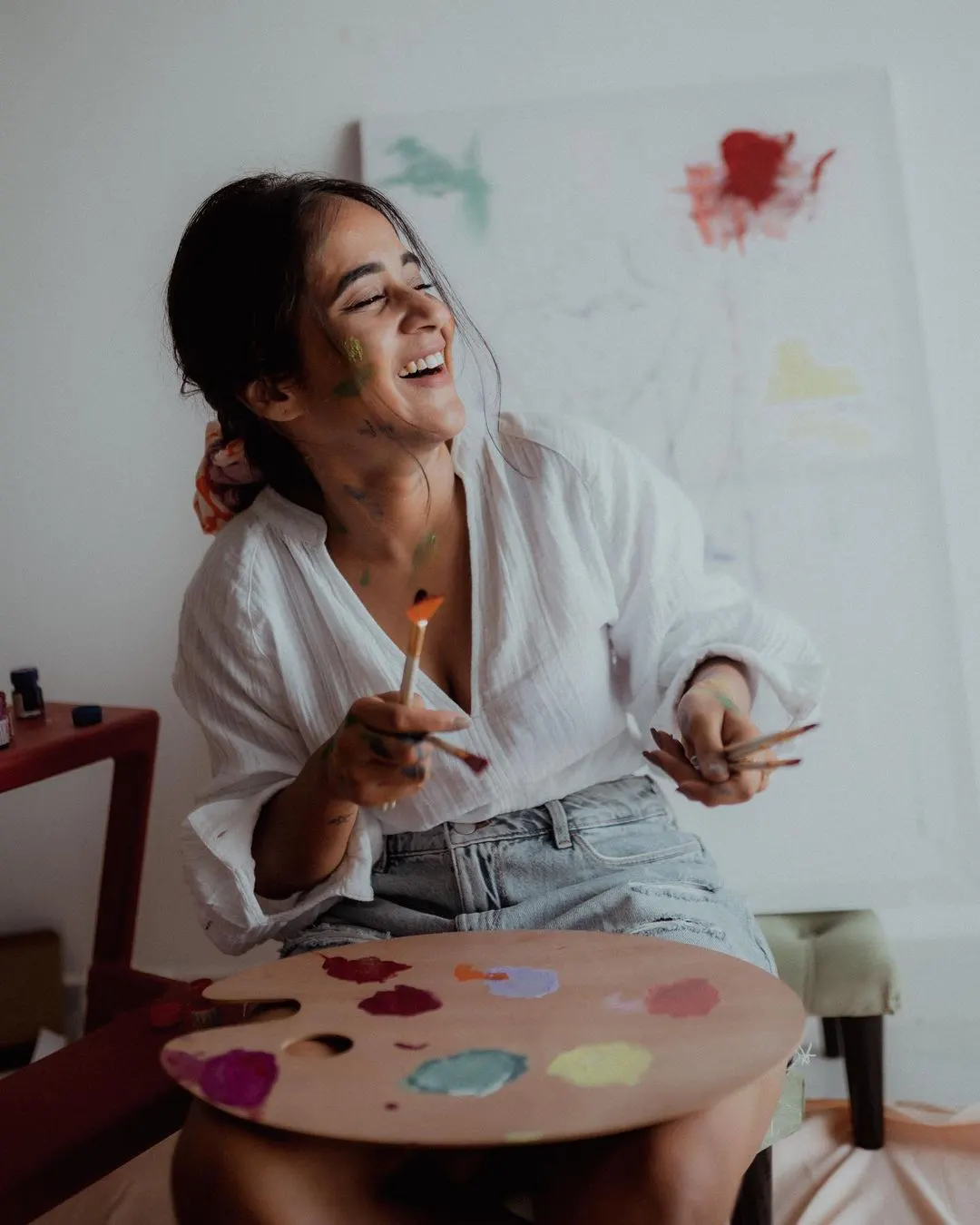 Deepti Sunaina posing for fun while painting