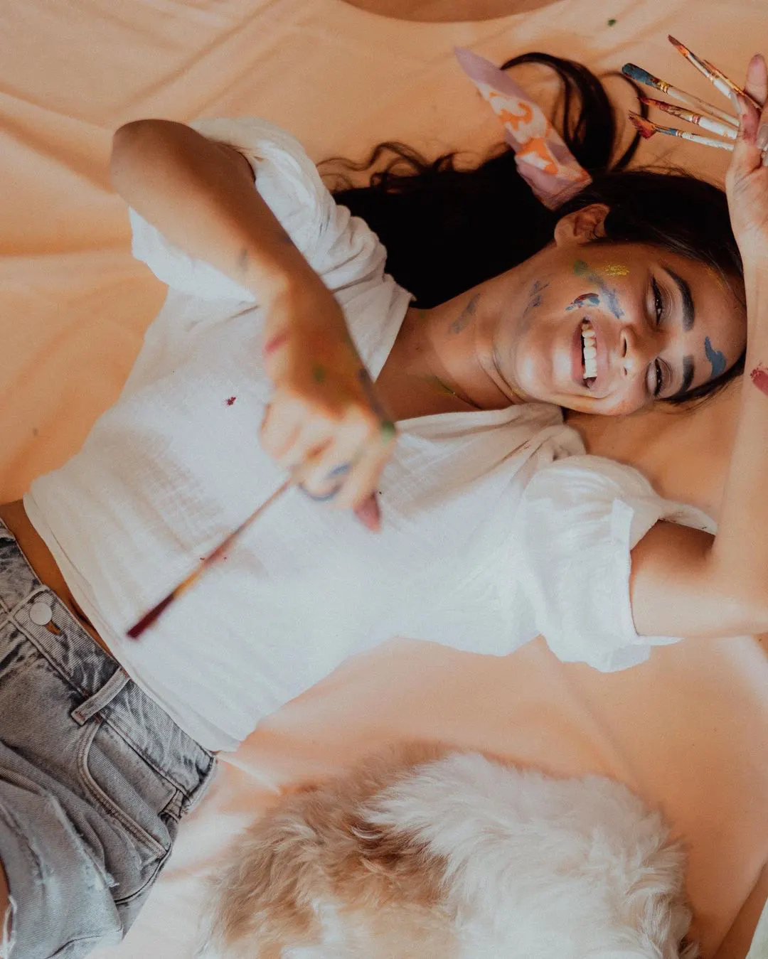 Deepti Sunaina posing for fun while painting