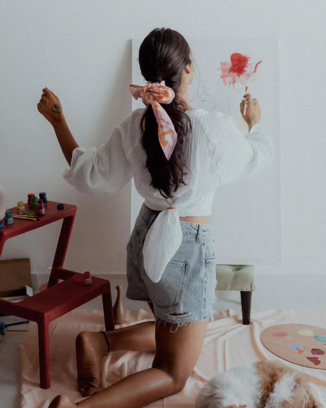 Deepti Sunaina posing for fun while painting