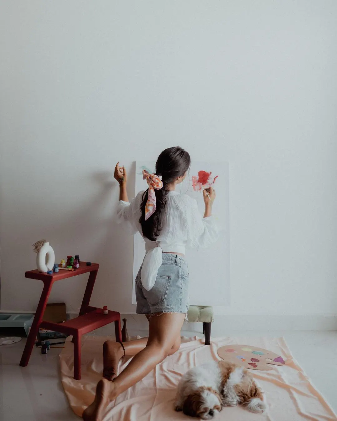 Deepti Sunaina posing for fun while painting