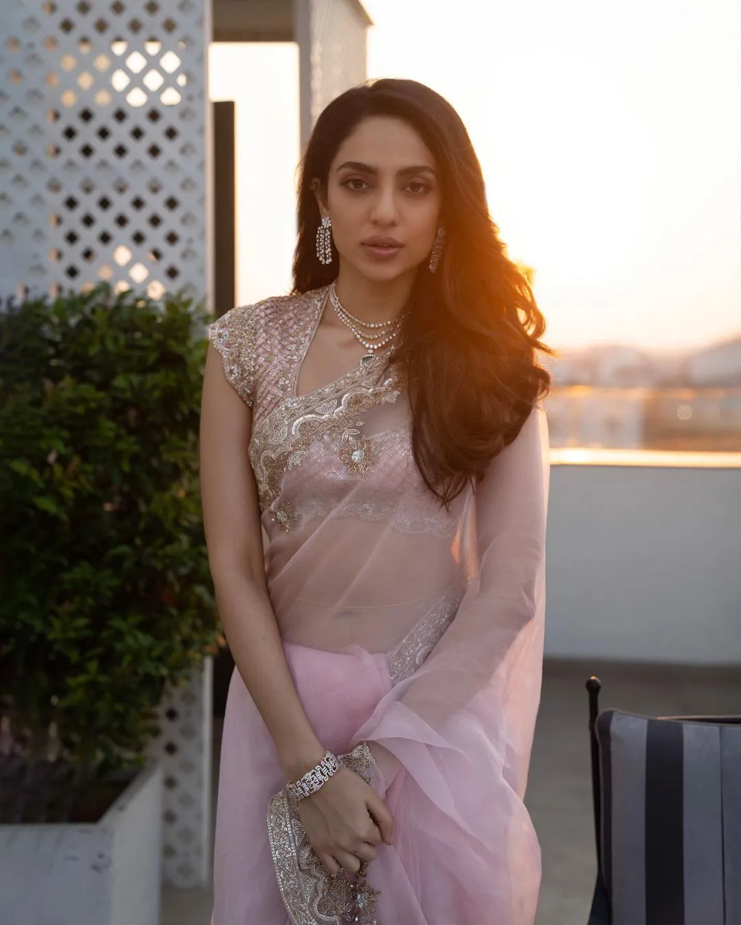 Sobhita Dhulipala shines in a light pink color saree