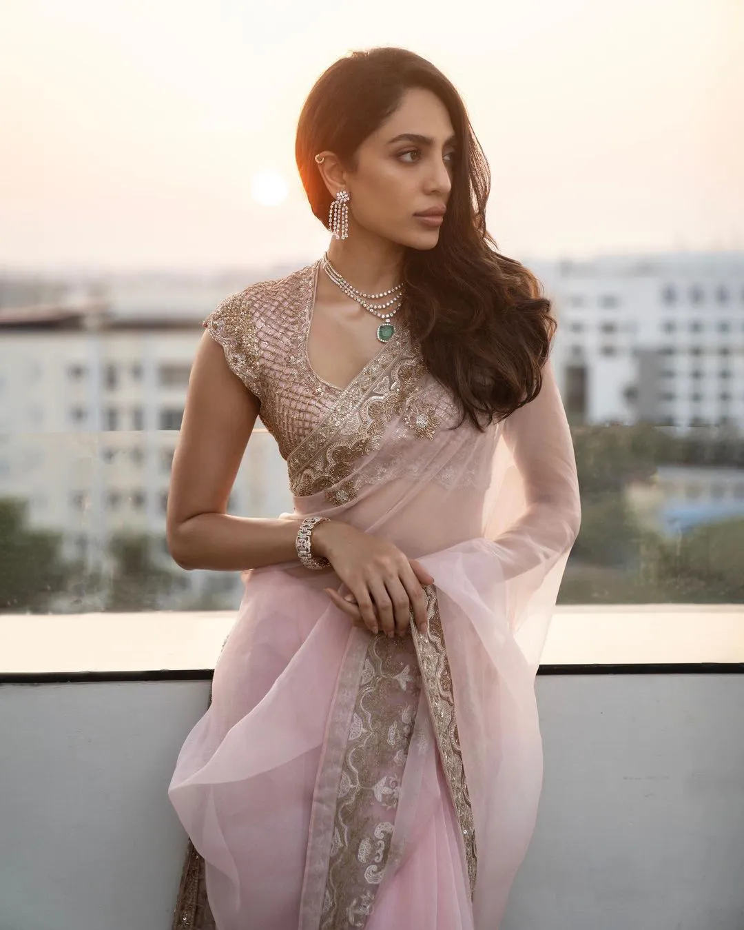 Sobhita Dhulipala shines in a light pink color saree