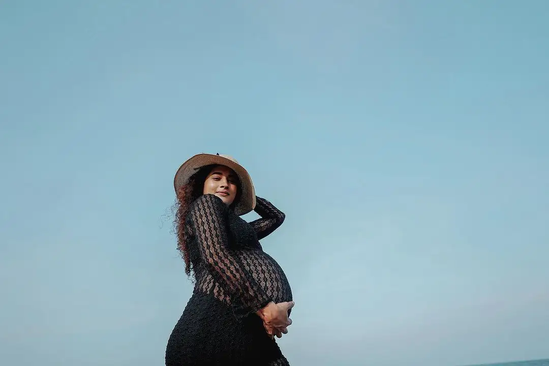 Actress Pooja Ramachandran Baby Bump Photo Shoot with Husband at Beach