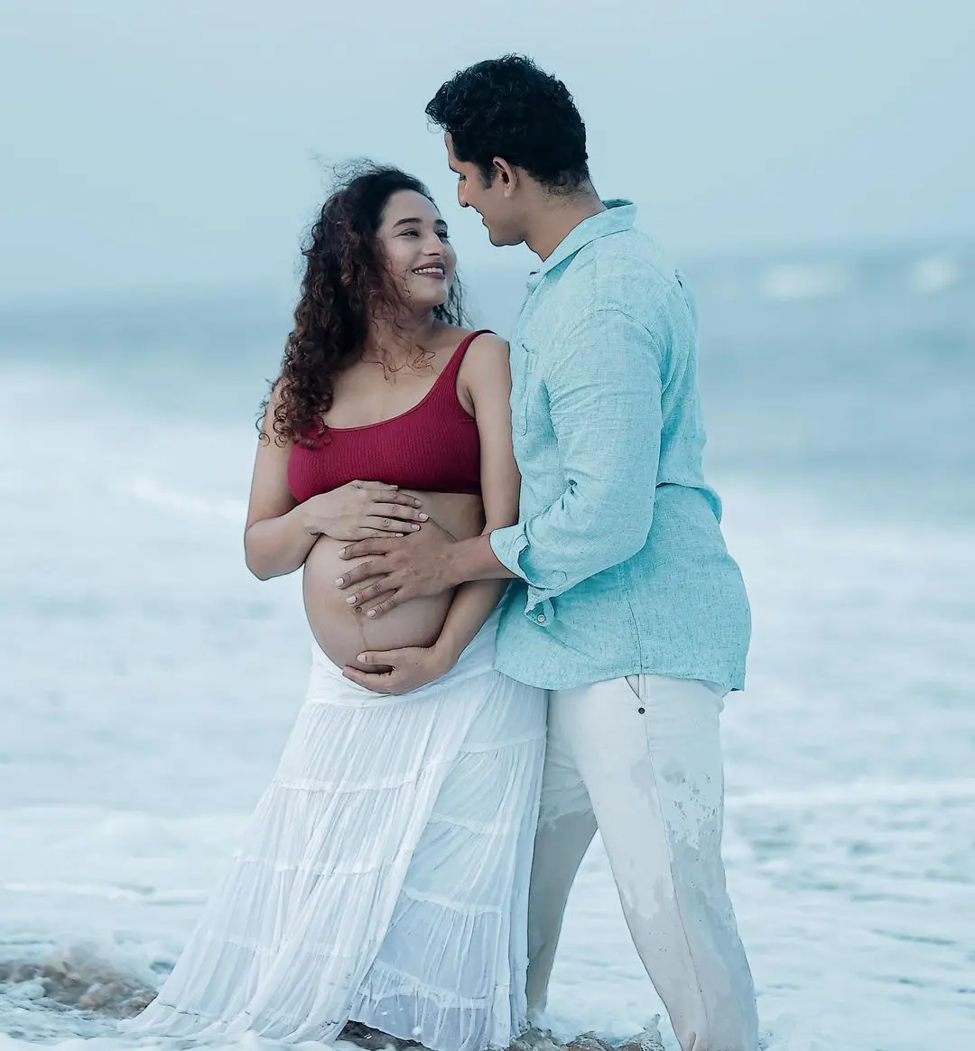 Actress Pooja Ramachandran Baby Bump Photo Shoot with Husband at Beach