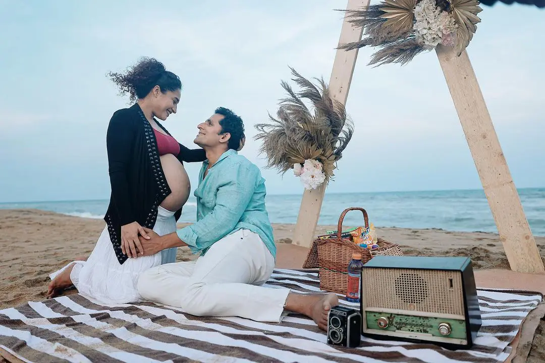Actress Pooja Ramachandran Baby Bump Photo Shoot with Husband at Beach