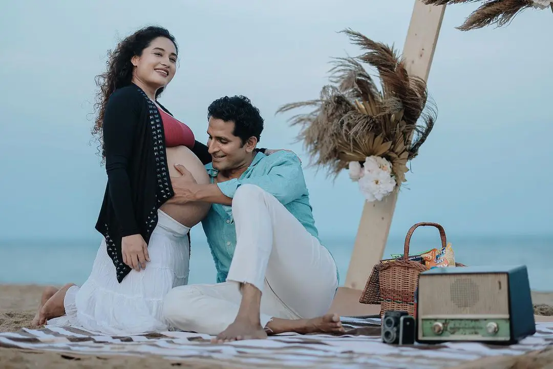 Actress Pooja Ramachandran Baby Bump Photo Shoot with Husband at Beach