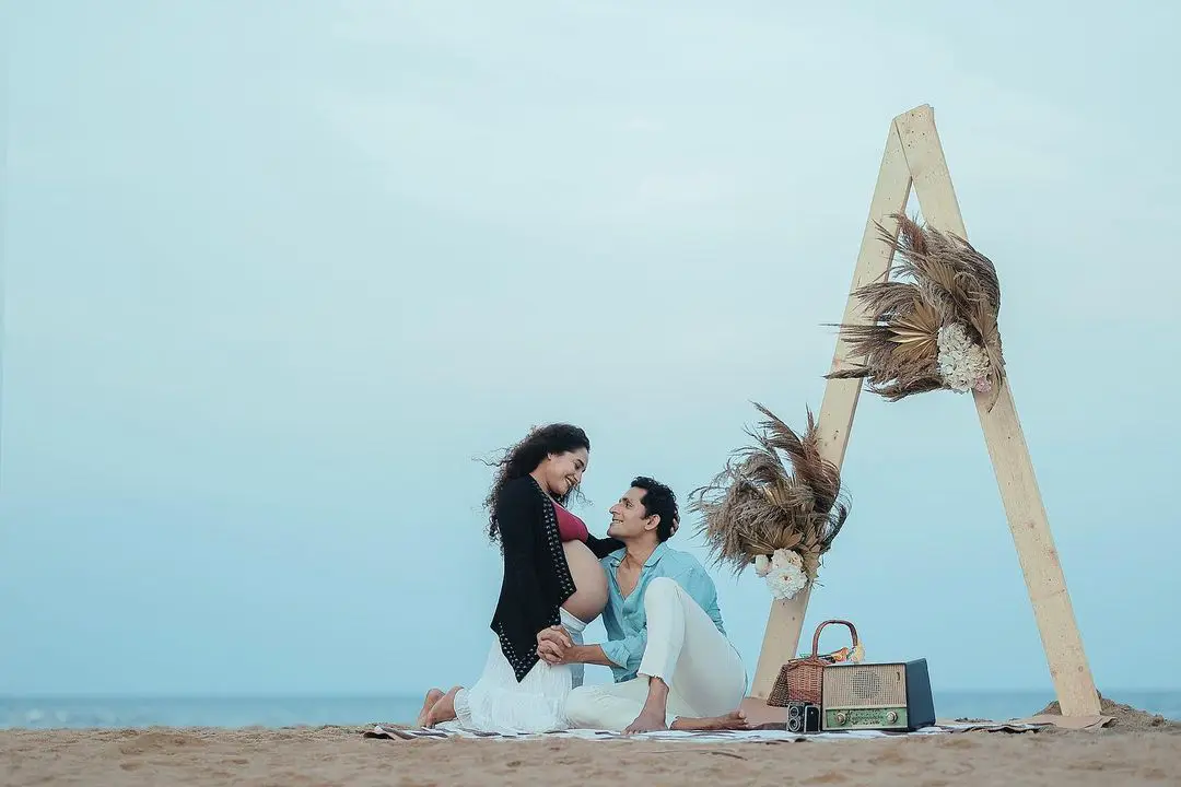 Actress Pooja Ramachandran Baby Bump Photo Shoot with Husband at Beach