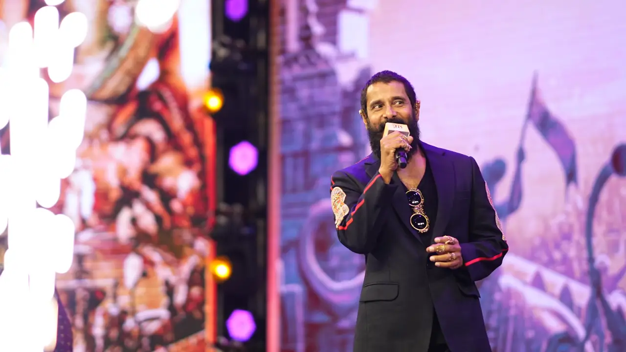 Vikram Stylish looks in Ponniyin Selvan 2 Pre Release Event at Hyderabad