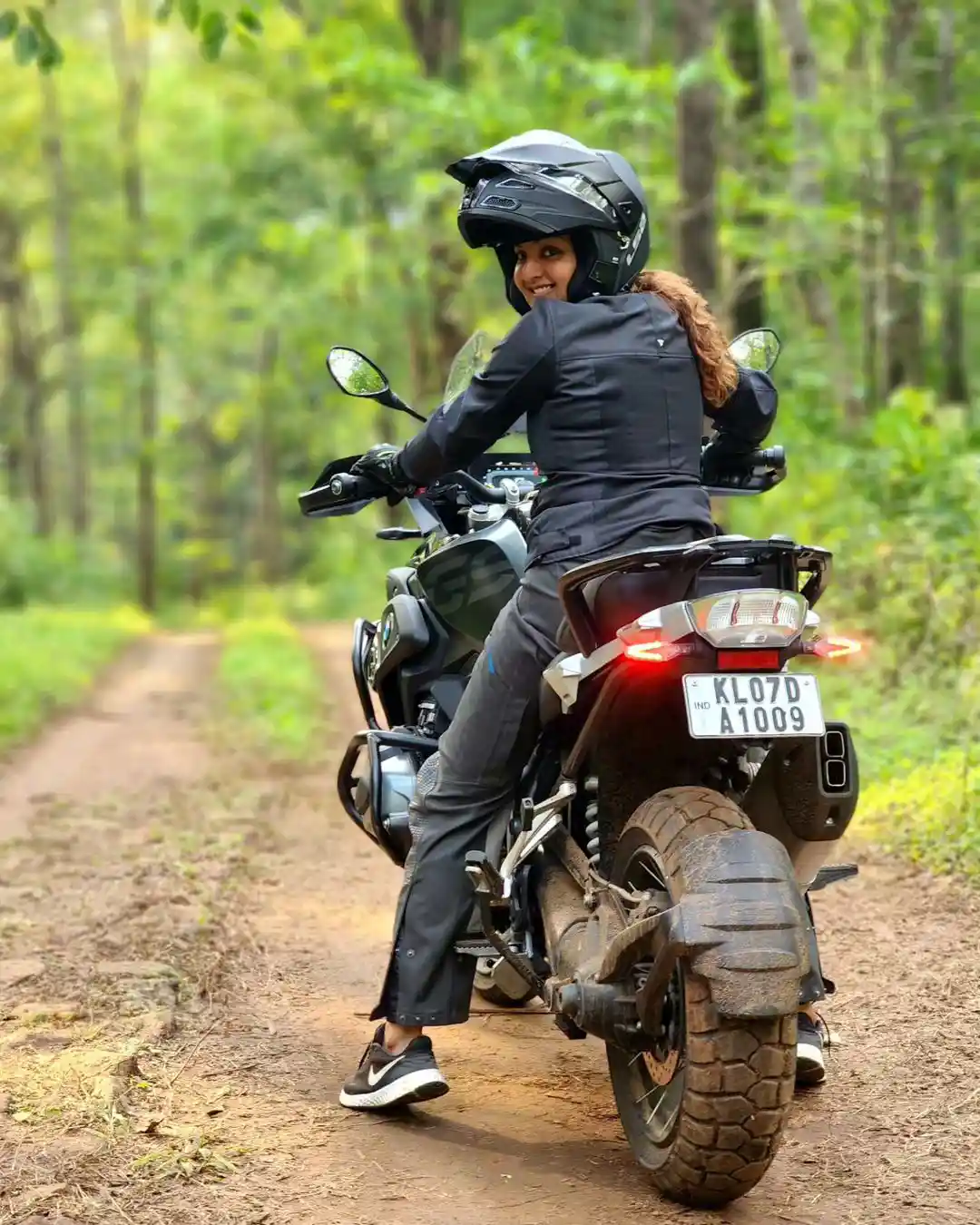 Malayala Actress Manju Warrier Bike Riding at Forest area photos