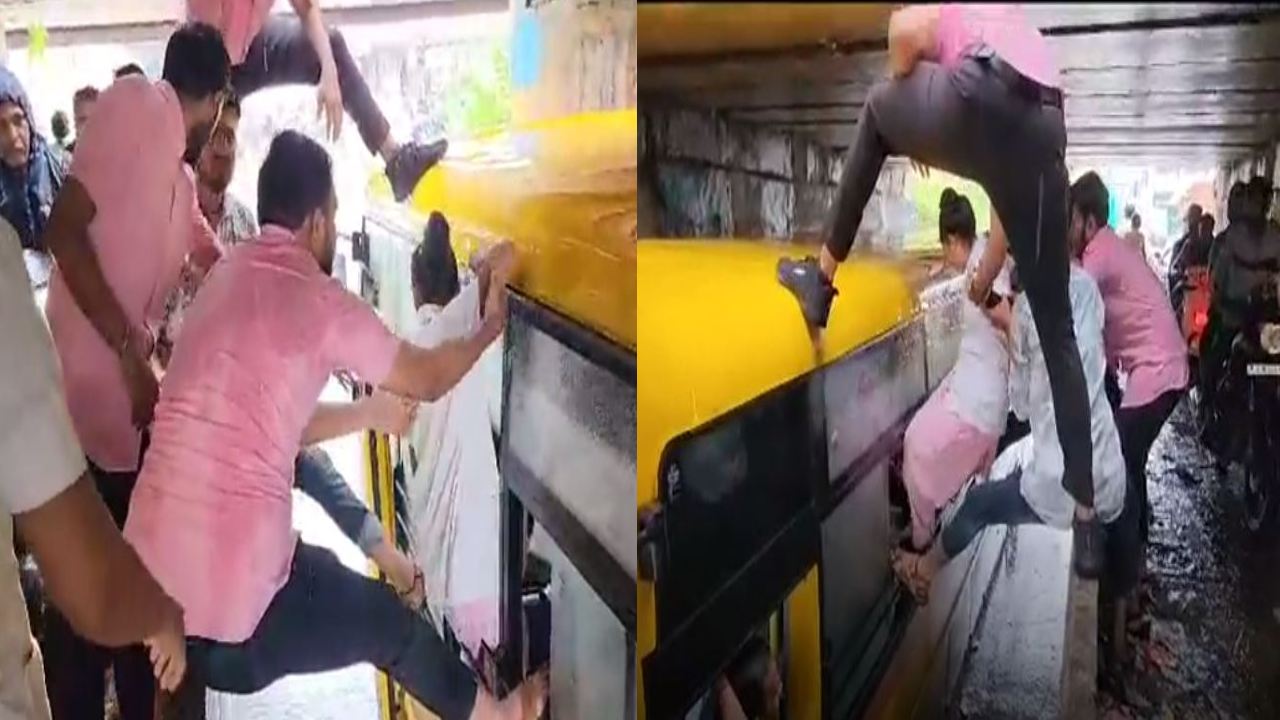 Gujarat : భారీ వర్షంలో చిక్కుకున్న బస్సు.. విండో ద్వారా బయటకు వచ్చిన విద్యార్ధులు