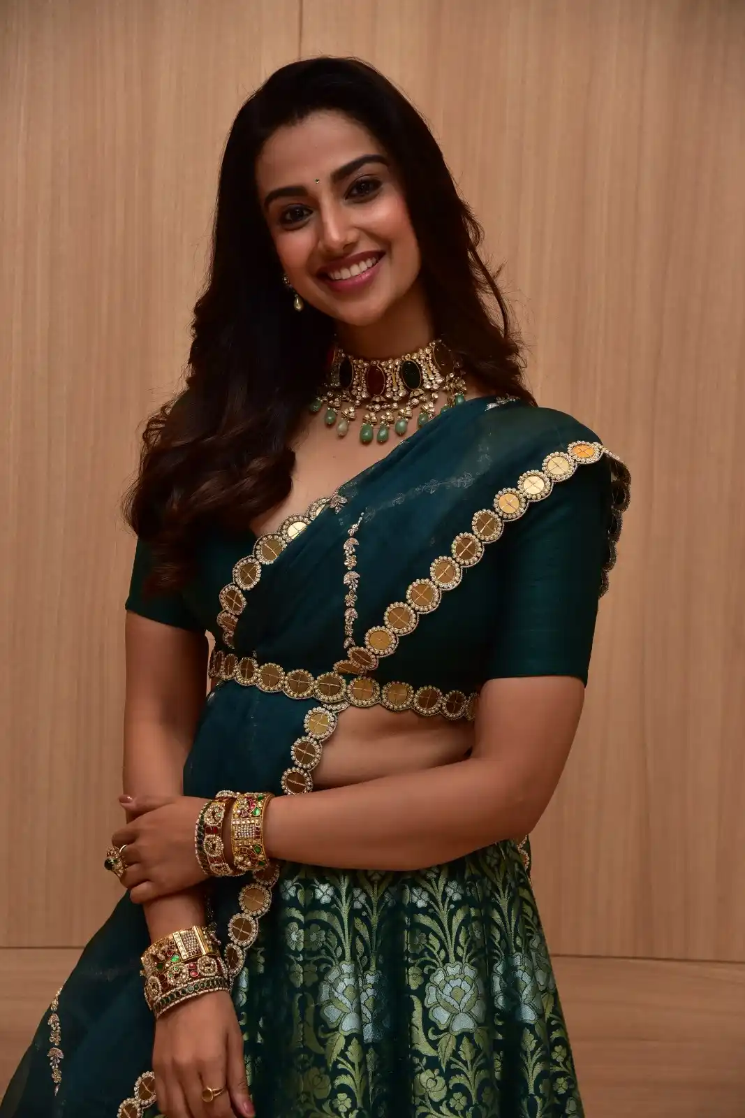 Meenakshi Chaudhary latest stills in Half Saree