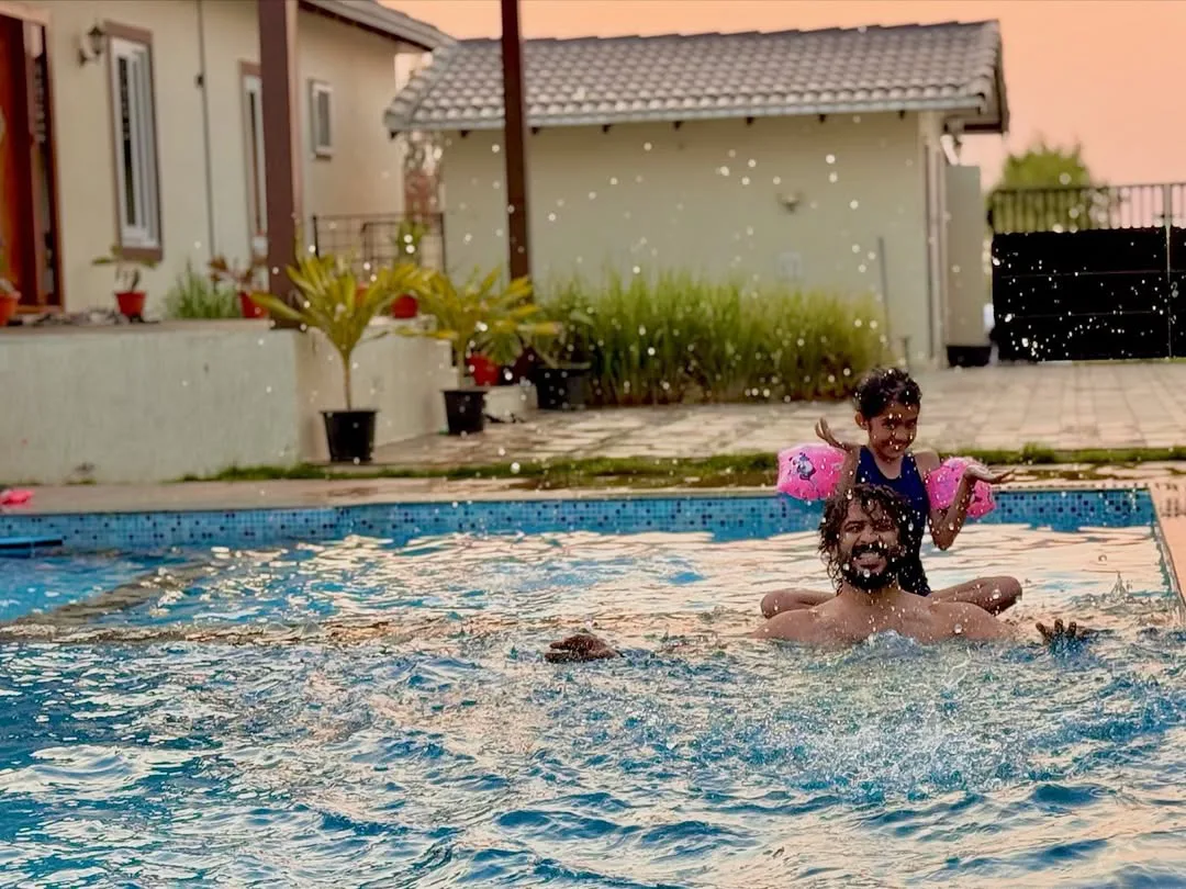 anchor ravi family enjoying in swimming pool