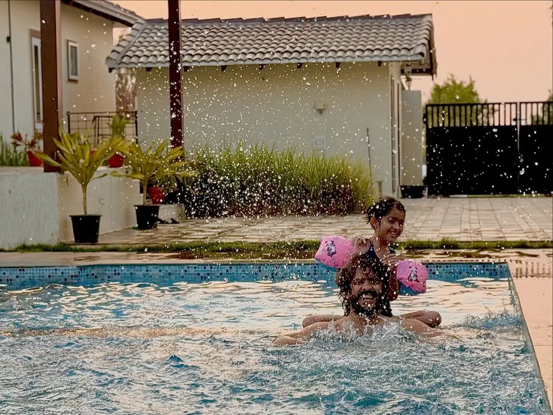 anchor ravi family enjoying in swimming pool