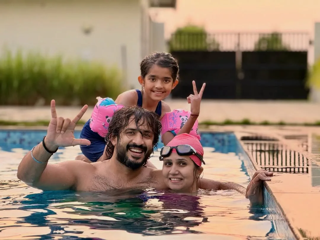 anchor ravi family enjoying in swimming pool