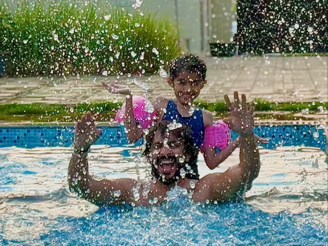 anchor ravi family enjoying in swimming pool