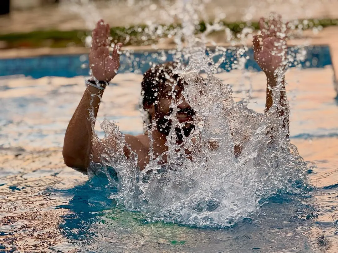 anchor ravi family enjoying in swimming pool