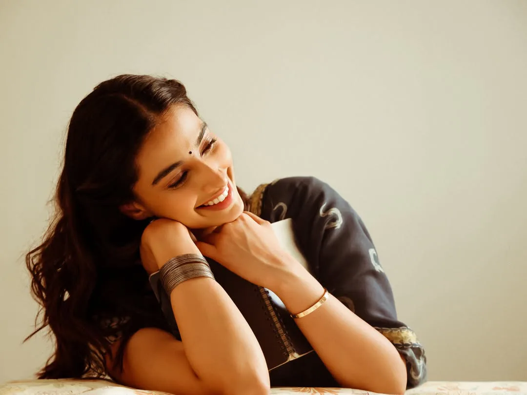 Meenakshi Chaudhary strikes cute poses for photos with a book