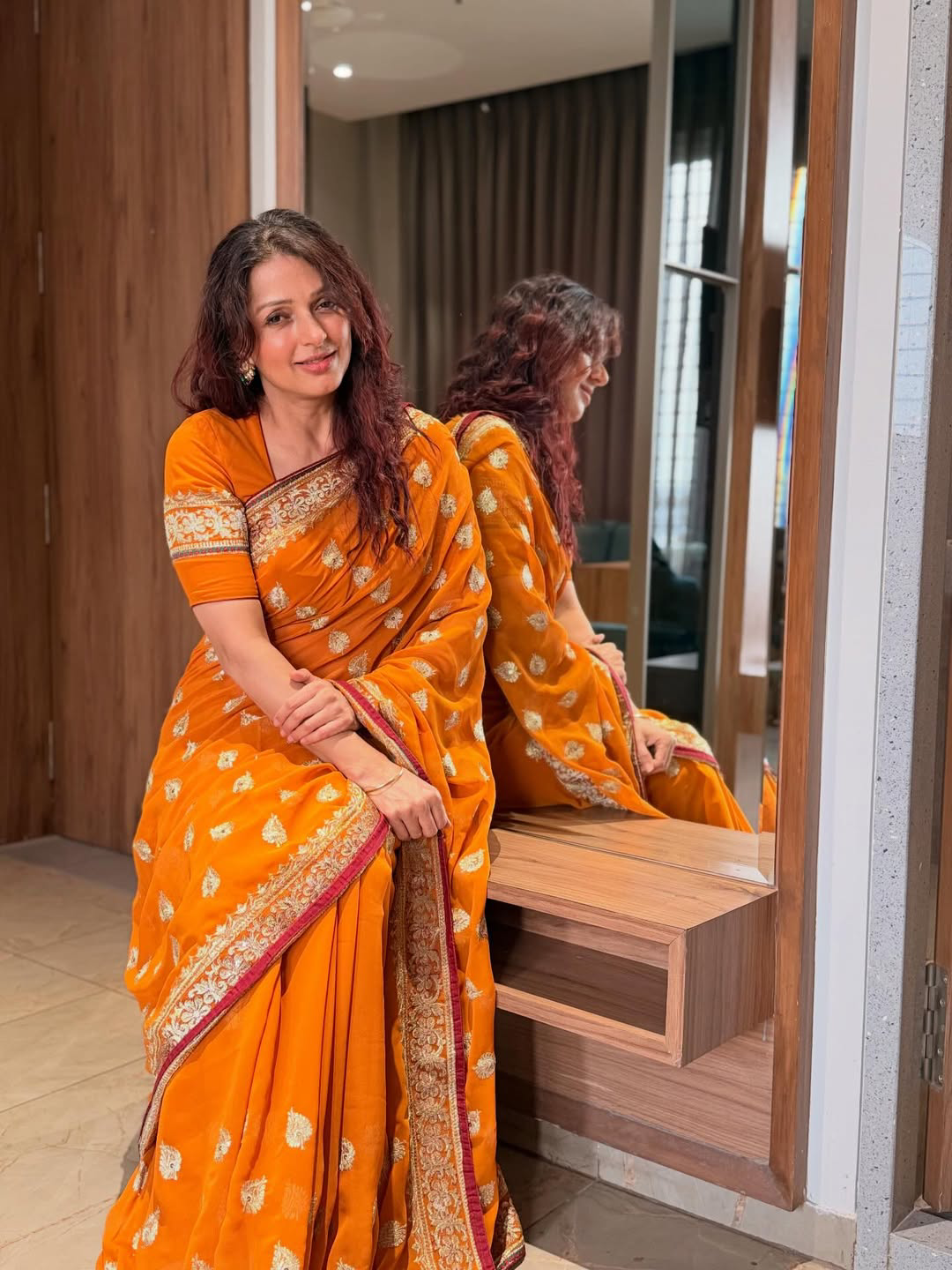 Pawan kalyan Heroine Bhumika Chawla stunning looks in orange saree