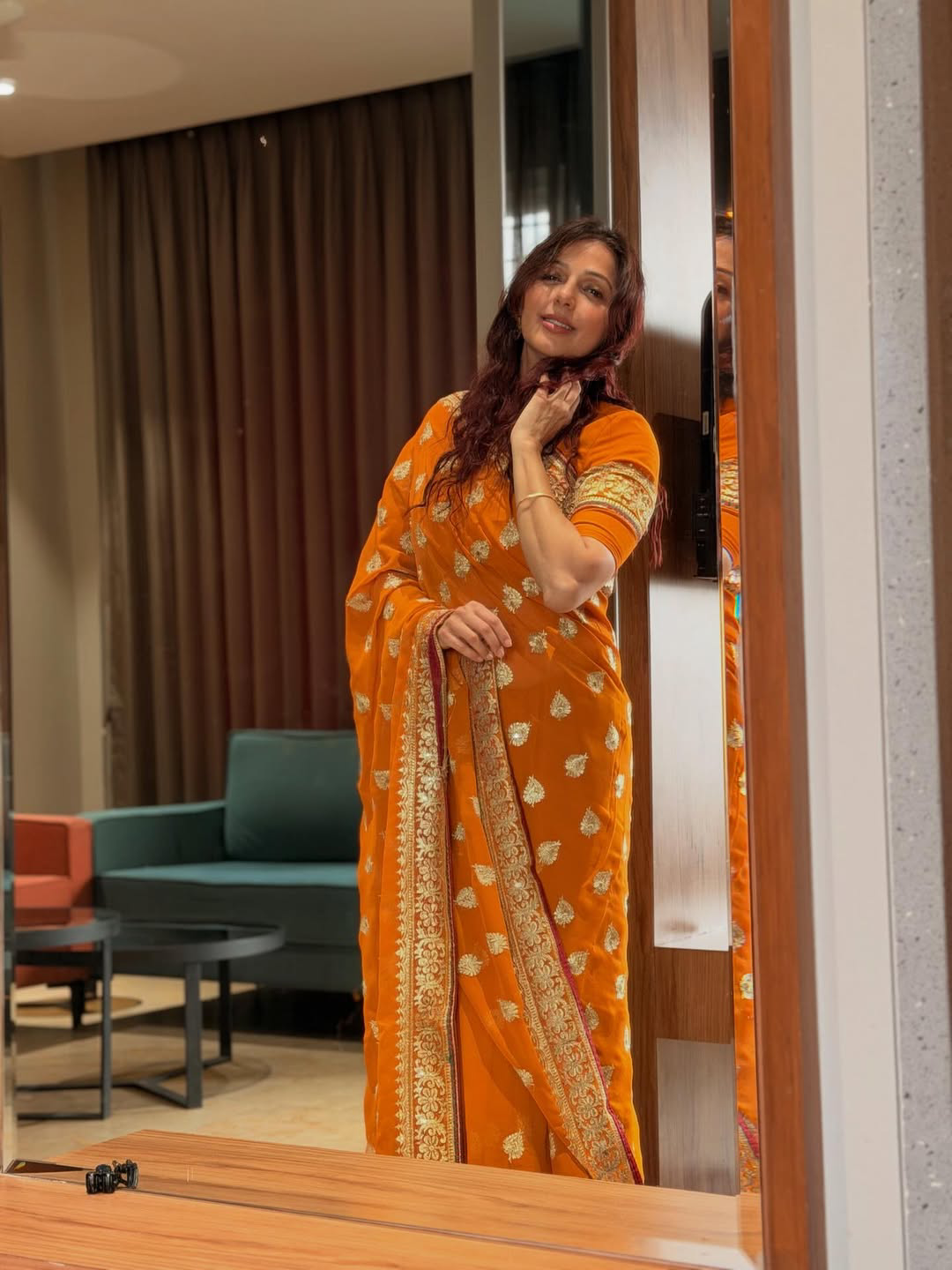 Pawan kalyan Heroine Bhumika Chawla stunning looks in orange saree