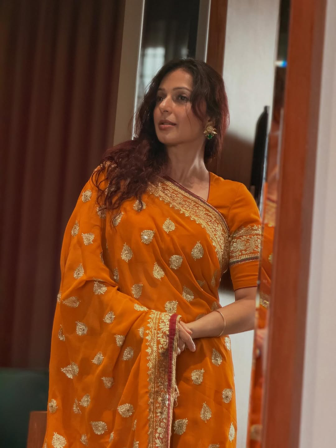 Pawan kalyan Heroine Bhumika Chawla stunning looks in orange saree