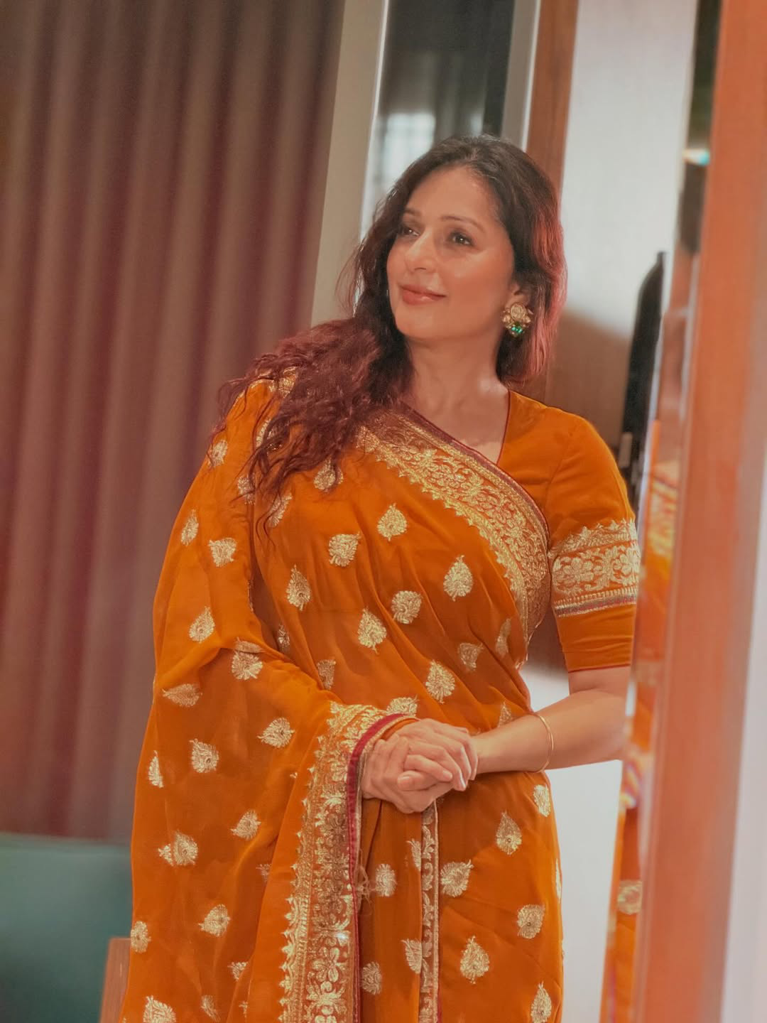 Pawan kalyan Heroine Bhumika Chawla stunning looks in orange saree