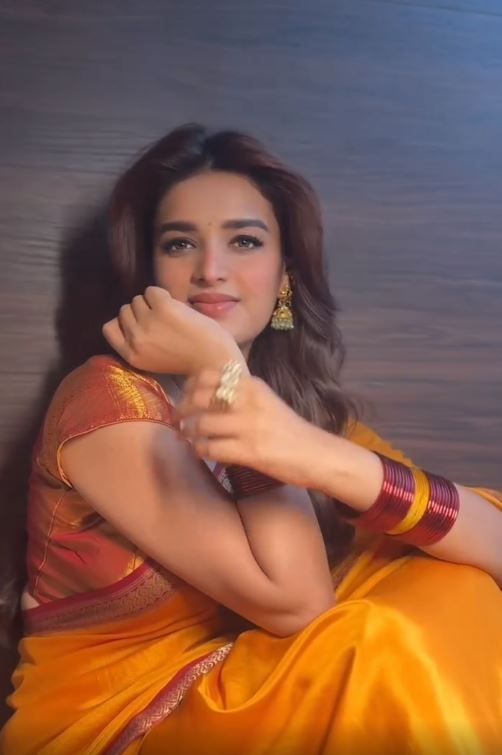 Nidhhi Agerwal fed the cows