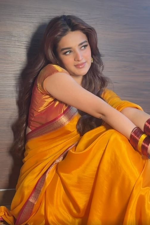 Nidhhi Agerwal fed the cows