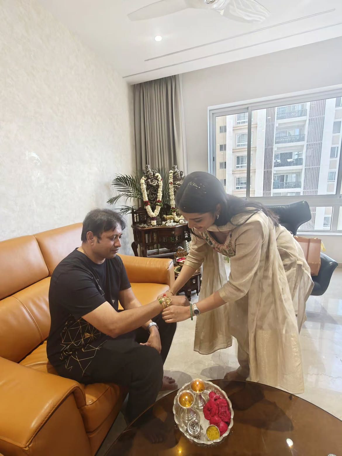 Sri Gouri Priya Tied Rakhi to Producer SKN
