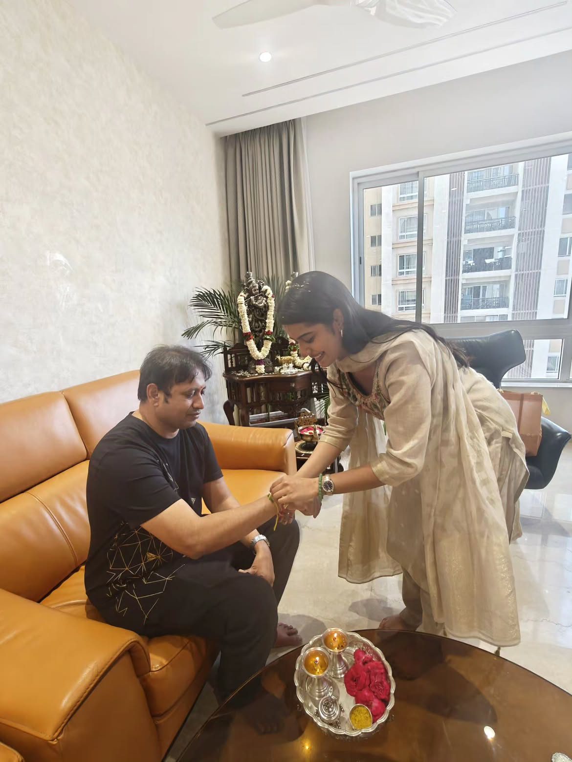 Sri Gouri Priya Tied Rakhi to Producer SKN