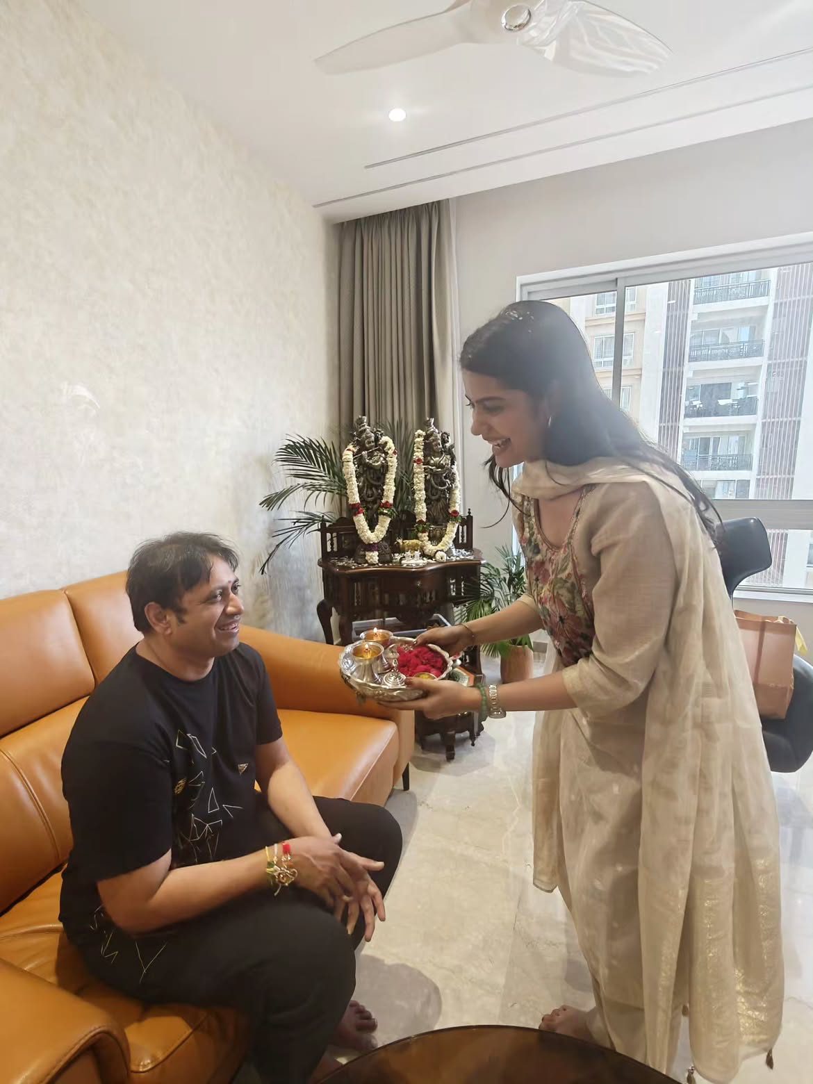 Sri Gouri Priya Tied Rakhi to Producer SKN