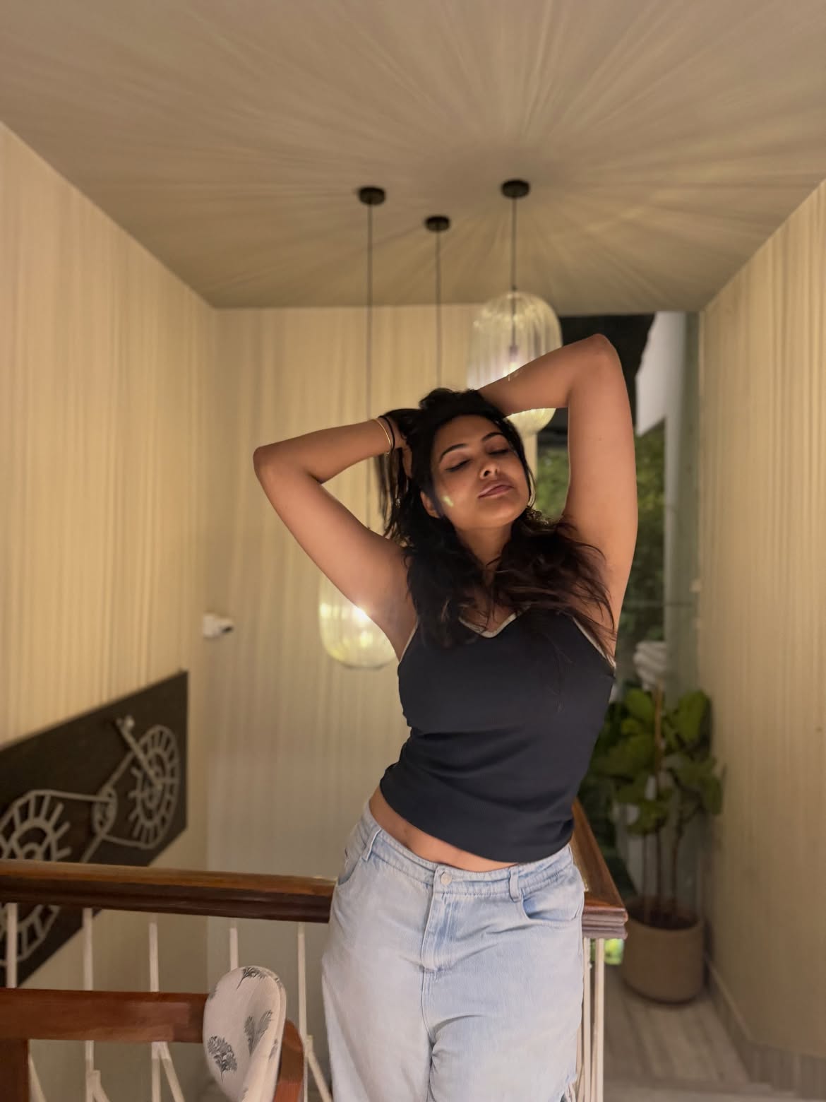 Divi Poses in Torn Jeans