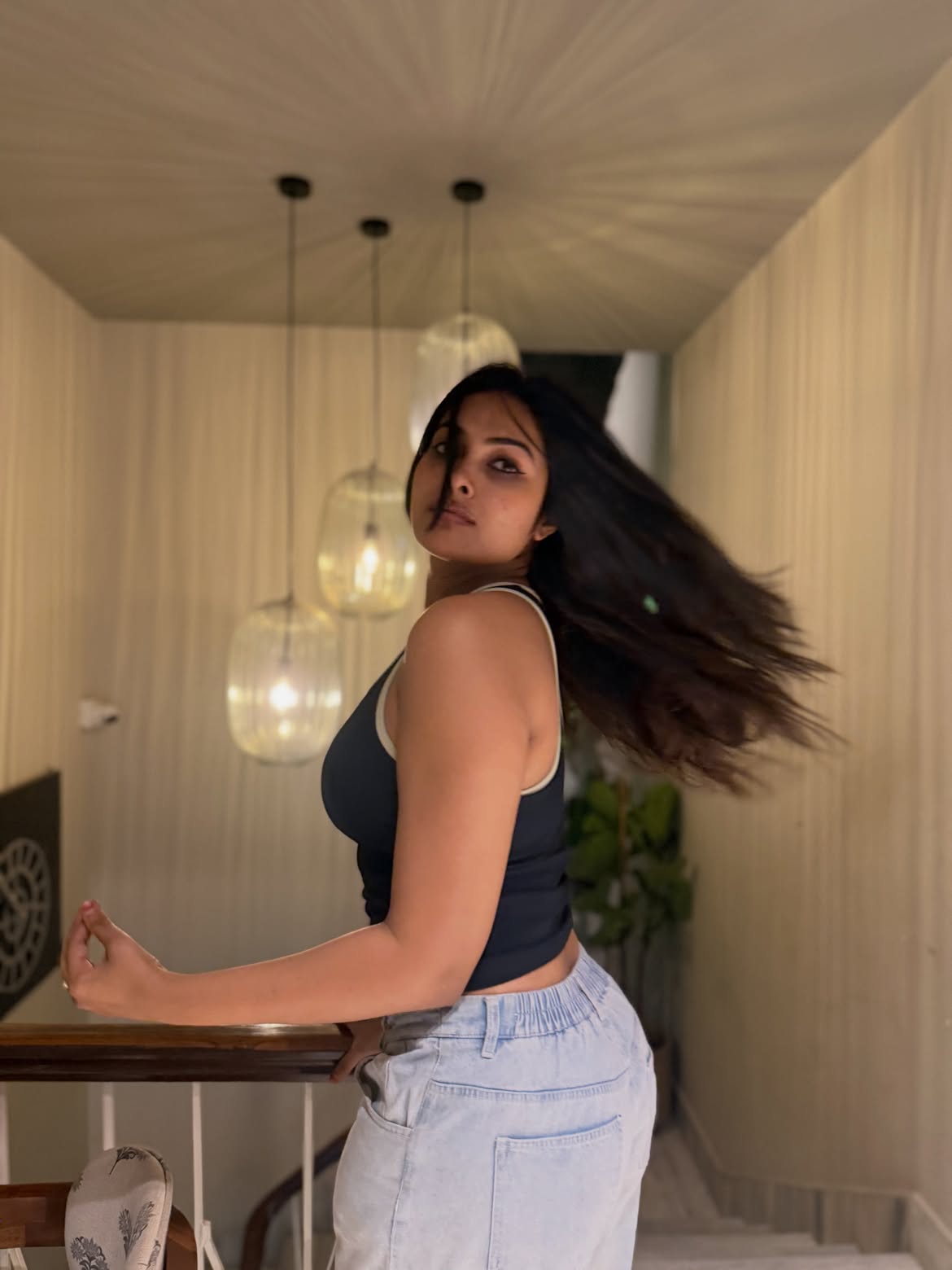 Divi Poses in Torn Jeans