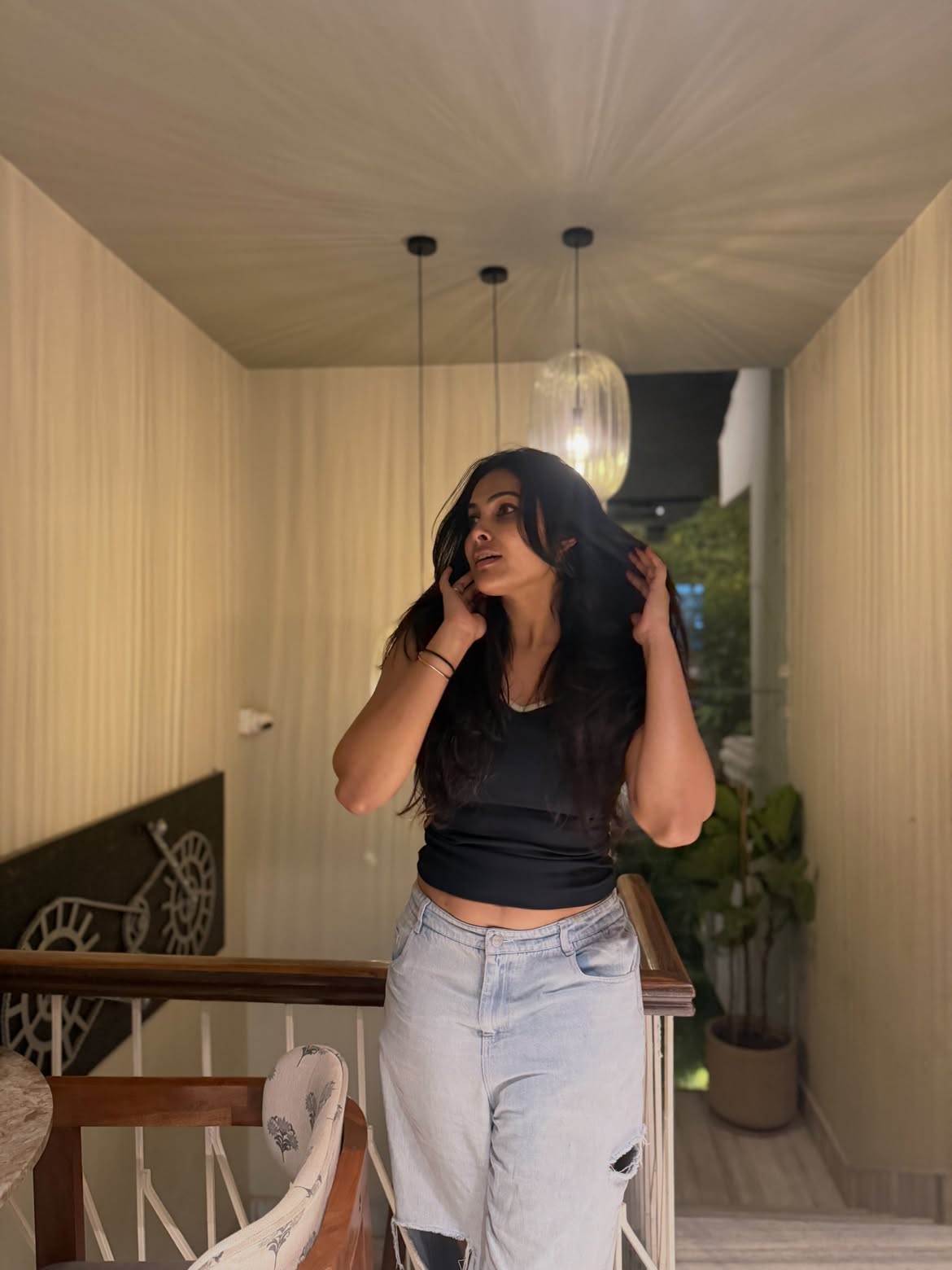 Divi Poses in Torn Jeans