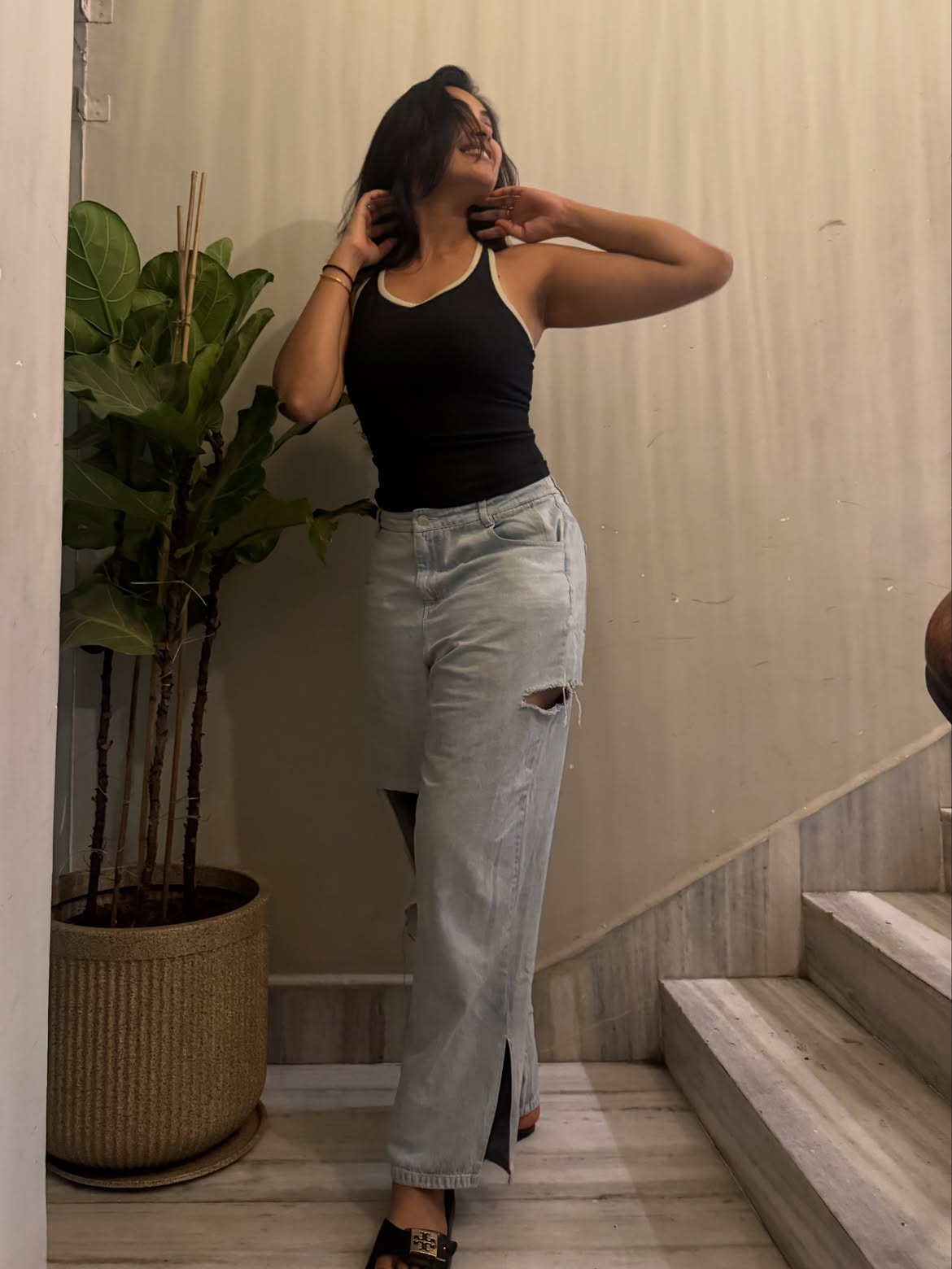 Divi Poses in Torn Jeans
