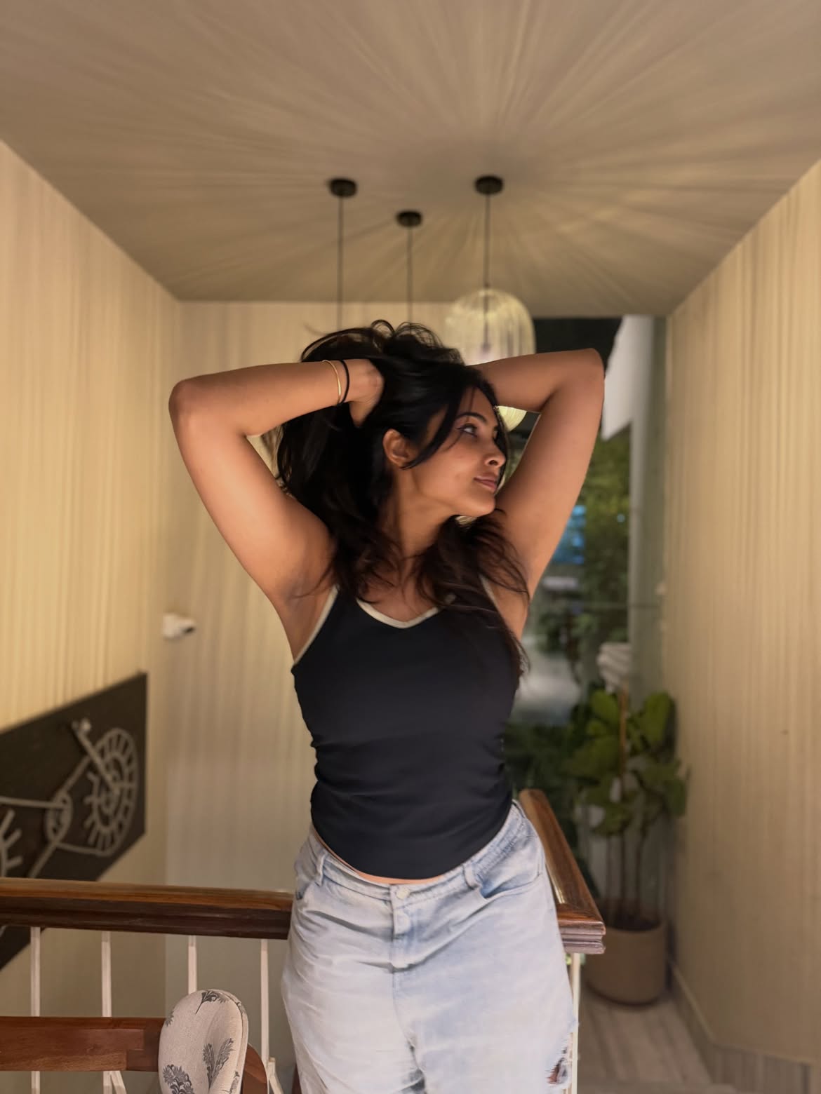 Divi Poses in Torn Jeans