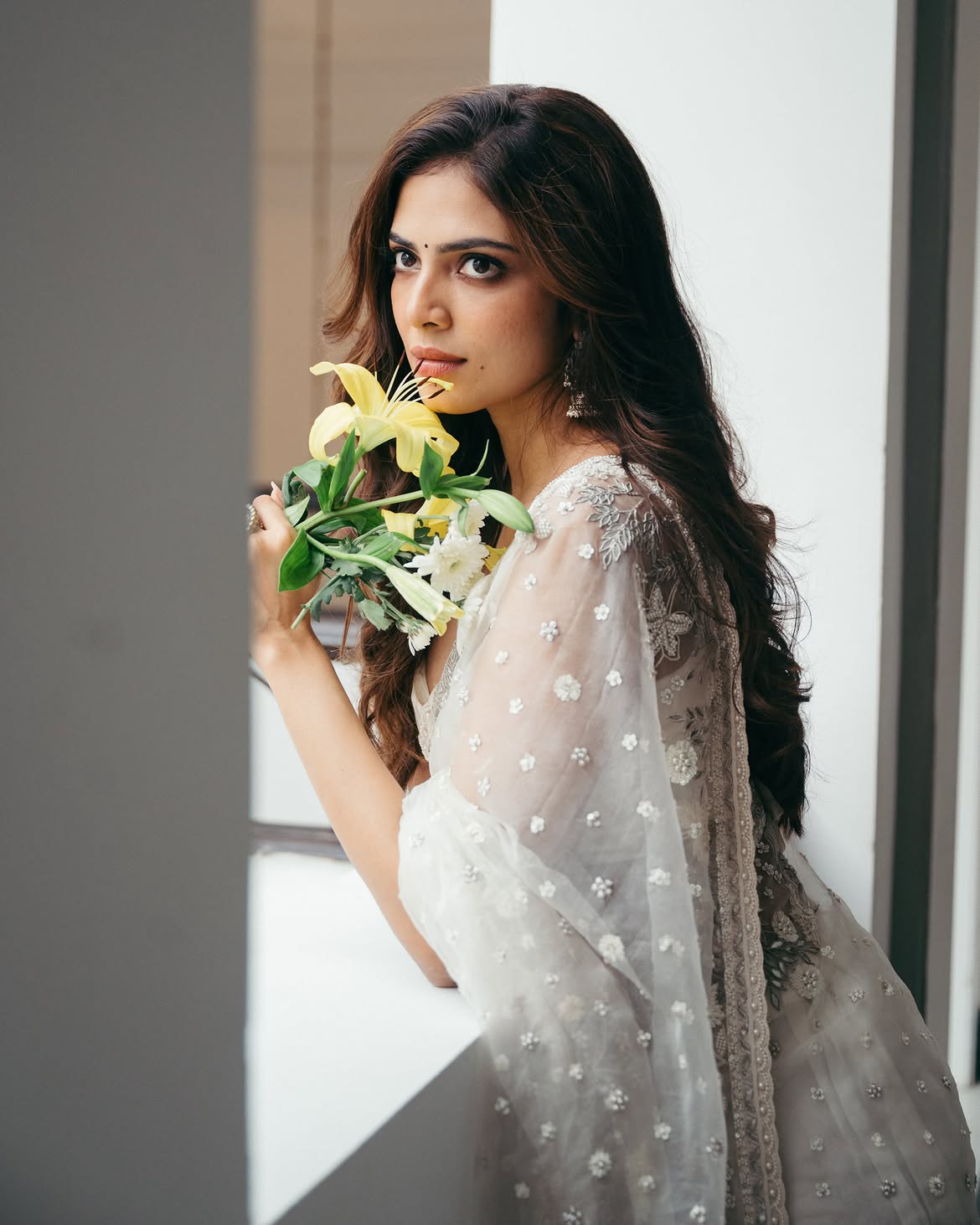 Malavika Mohanan Shows her Beauty in Transparent White Saree