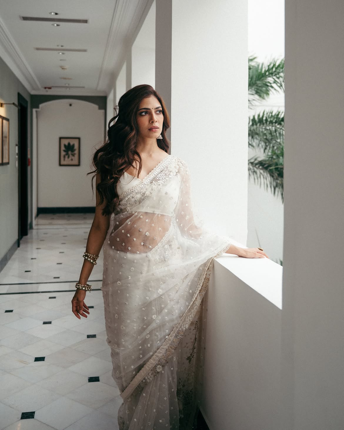 Malavika Mohanan Shows her Beauty in Transparent White Saree
