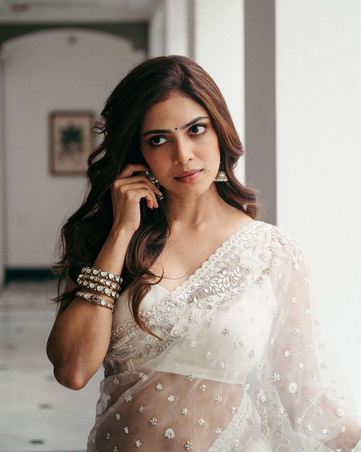 Malavika Mohanan Shows her Beauty in Transparent White Saree