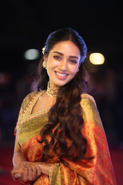 Nivetha Pethuraj Stunning Looks in Saree at Aadarsha Kutumbam Pre Release Event